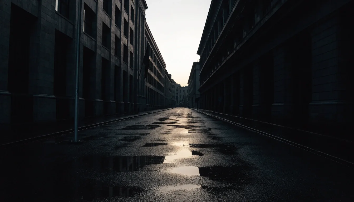 A rain-wet city street at midnight under sodium streetlight, the newsstand awning dark at the curb